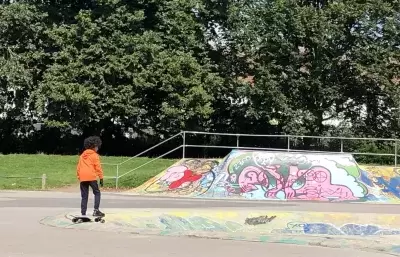 Child skating in skate park